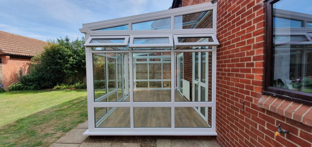 White uPVC glazed conservatory on a brick house