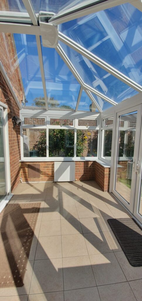 White uPVC bay window fitted in a brick house